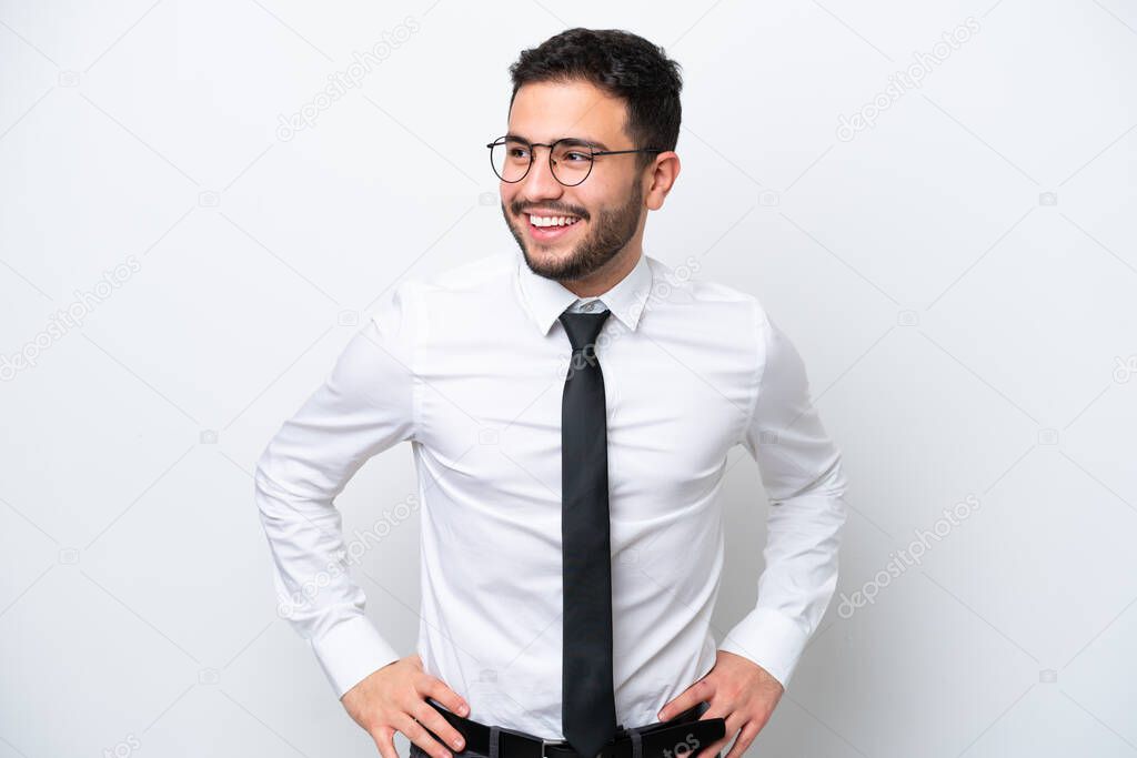 Business Brazilian man isolated on white background posing with arms at hip and smiling