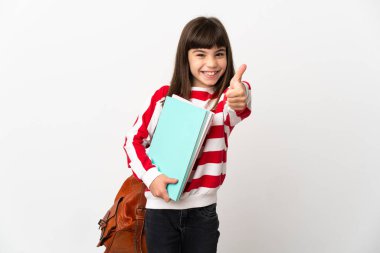 Beyaz arka planda izole edilmiş küçük bir kız. Başparmakları havada. Çünkü iyi bir şey oldu.