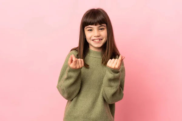 Malá Dívka Izolované Růžovém Pozadí Dělat Peníze Gesto — Stock fotografie