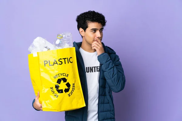 Young Venezuelan Man Holding Bag Full Plastic Bottles Having Doubts — Stock Photo, Image