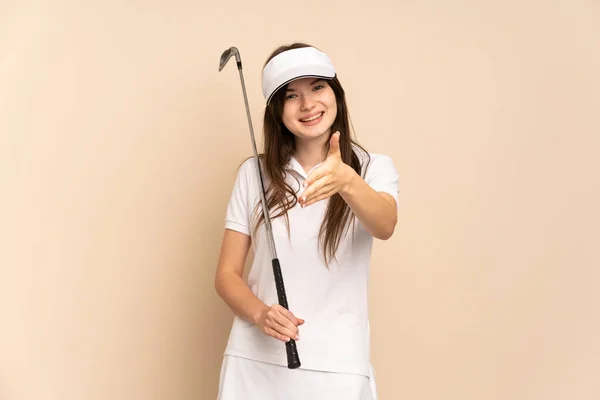 Joven Chica Golfista Ucraniano Aislado Fondo Beige Estrechando Las Manos — Foto de Stock