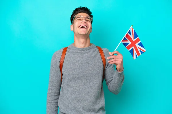 Junger Kaukasischer Mann Mit Einer Britischen Flagge Auf Blauem Hintergrund — Stockfoto