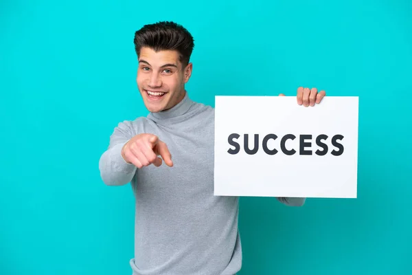 Young Handsome Caucasian Man Isolated Blue Bakcground Holding Placard Text — Stock Photo, Image