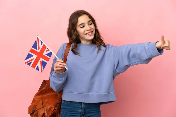 Little Girl Holding United Kingdom Flag Isolated Pink Background Giving — Stock Fotó