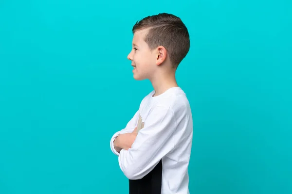 Ragazzino Isolato Sfondo Blu Posizione Laterale — Foto Stock