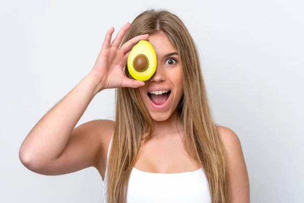 Young Caucasian Woman Isolated White Background Holding Avocado While Smiling — Stock Photo, Image