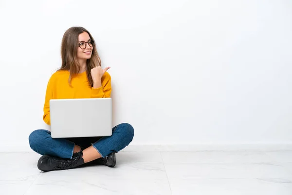 Young Caucasian Woman Laptop Sitting Floor Isolated White Background Pointing — Stock Photo, Image