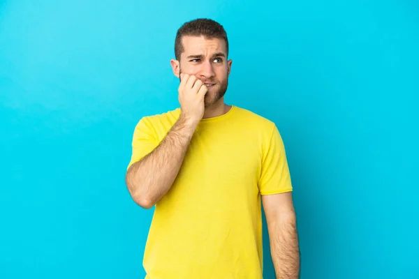 Young Handsome Caucasian Man Isolated Blue Background Little Bit Nervous — Stock Photo, Image