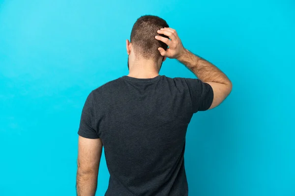 Young Handsome Caucasian Man Isolated Blue Background Back Position Thinking — Stock Photo, Image