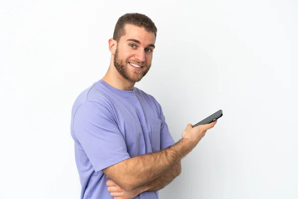 Young Handsome Caucasian Man Isolated White Background Holding Mobile Phone — Stock Photo, Image