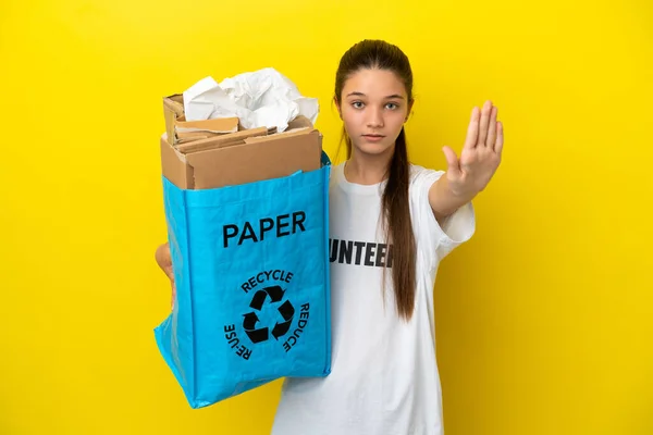 Little Girl Holding Recycling Bag Full Paper Recycle Isolated Yellow — Stock Photo, Image