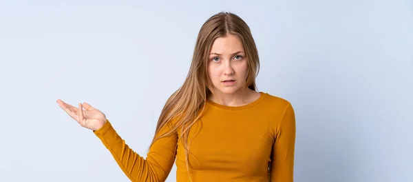 Teenager Ukrainian Girl Isolated Blue Background Making Doubts Gesture — Stock Photo, Image