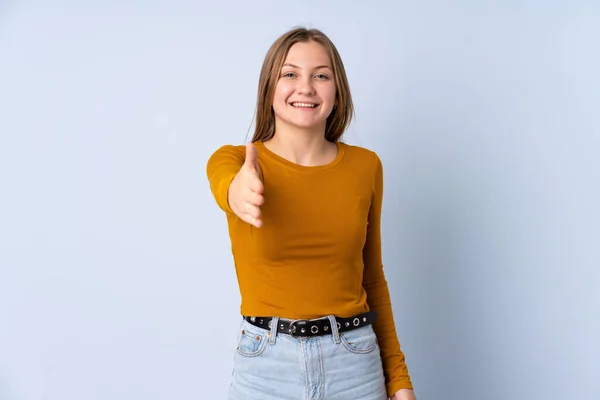 Teenager Ukrainian Girl Isolated Blue Background Shaking Hands Closing Good — Stock Photo, Image