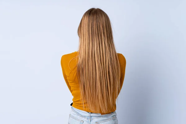 Adolescente Ucraniano Chica Aislado Sobre Fondo Azul Espalda Posición —  Fotos de Stock