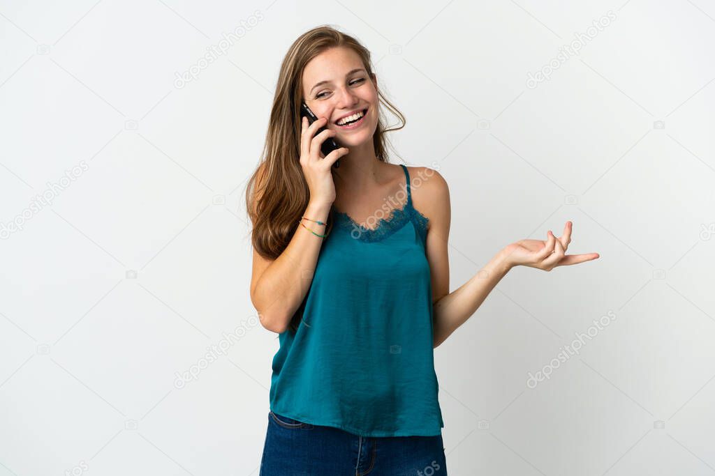 Young caucasian woman over isolated background keeping a conversation with the mobile phone with someone
