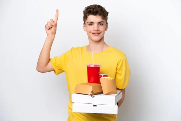 Підліток Росіянин Який Тримає Швидку Їжу Ізольованою Білому Фоні Вказує — стокове фото