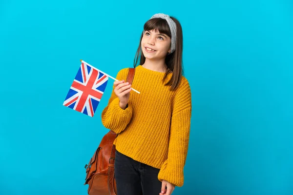 Mała Dziewczynka Studiuje Angielski Odizolowany Niebieskim Tle Myśląc Pomysł Podczas — Zdjęcie stockowe