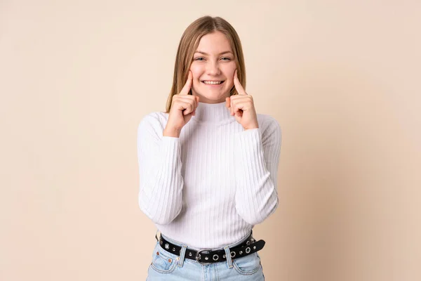 Teenager Ukrainian Girl Isolated Beige Background Smiling Happy Pleasant Expression — Stock Photo, Image