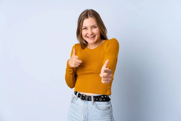 Teenager Ukrainian Girl Isolated Blue Background Pointing Front Smiling — Stock Photo, Image