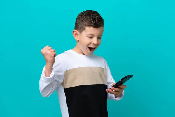 Little Kid Boy Isolated Blue Background Phone Victory Position — Stock Photo, Image