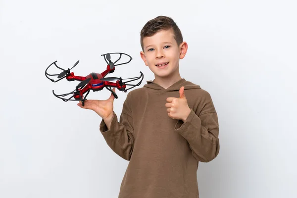 Little Caucasian Boy Holding Drone Isolated White Background Giving Thumbs — Stock Photo, Image