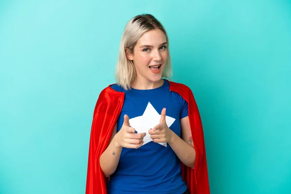 Super Hero Caucasian Woman Isolated Blue Background Pointing Front Smiling — Stock Photo, Image