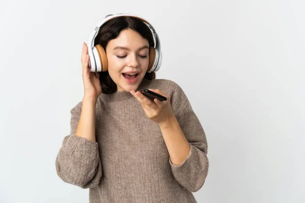 Έφηβη Ουκρανή Κοπέλα Απομονωμένη Λευκό Φόντο Ακούγοντας Μουσική Κινητό Και — Φωτογραφία Αρχείου