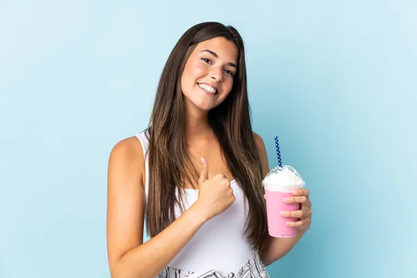Young Brazilian Woman Strawberry Milkshake Isolated Blue Background Giving Thumbs — Stock Photo, Image