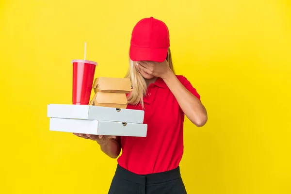 Delivery Uruguayan Woman Holding Fast Food Isolated Yellow Background Tired — Stock Photo, Image