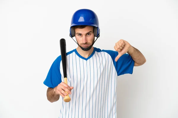 Młody Biały Mężczyzna Gra Baseball Białym Tle Pokazuje Kciuk Dół — Zdjęcie stockowe
