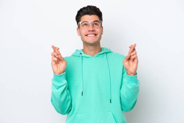 Beyaz fırında izole edilmiş genç yakışıklı beyaz adam şans diliyor ve en iyisini diliyor.