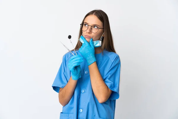 Lithuanian Woman Dentist Holding Tools Isolated Background Having Doubts — Stock Photo, Image