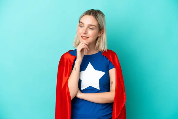 Super Hero Caucasian Woman Isolated Blue Background Looking Side — Stock Photo, Image