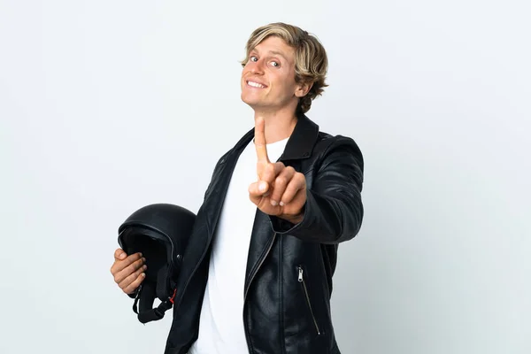 イギリス人男性保持Aオートバイヘルメットショーと持ち上げる指 — ストック写真