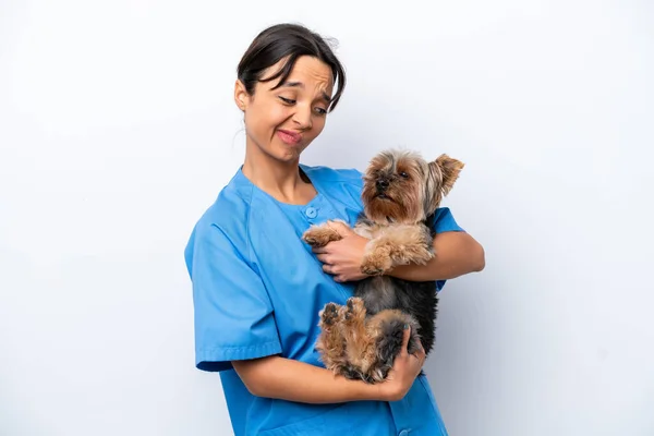 Young veterinarian woman with dog isolated on white background with sad expression