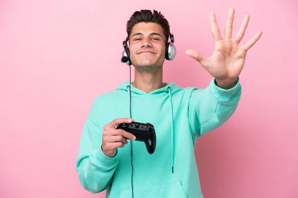 Young Handsome Caucasian Man Playing Video Game Controller Isolated Pink — Stock Photo, Image