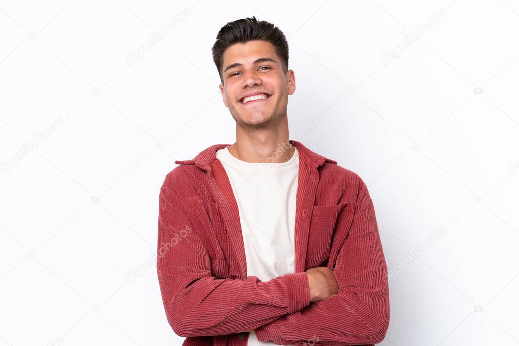Young caucasian man isolated on white background with arms crossed and looking forward