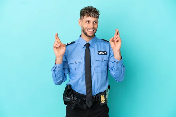 Joven Policía Rubia Hombre Aislado Blanco Sobre Fondo Azul Con —  Fotos de Stock