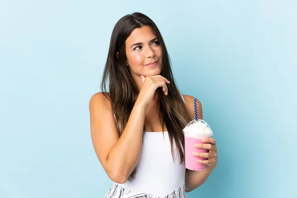 Young Brazilian Woman Strawberry Milkshake Isolated Blue Background Looking — Stock Photo, Image