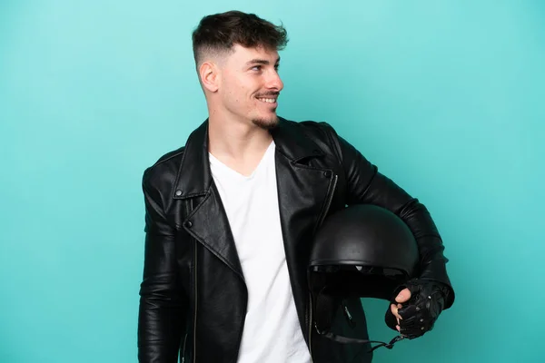 Young Caucasian Man Motorcycle Helmet Isolated Blue Background Looking Side — Stock Photo, Image