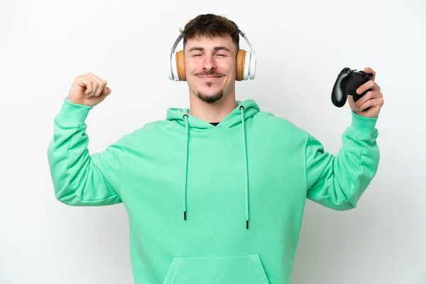 Junger Gutaussehender Mann Spielt Mit Einem Videospielcontroller Auf Weißem Hintergrund — Stockfoto