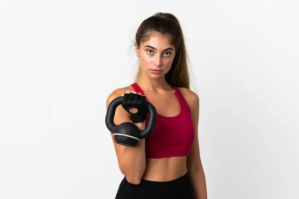 Ung Kaukasisk Kvinna Isolerad Vit Bakgrund Gör Tyngdlyftning Med Kettlebell — Stockfoto