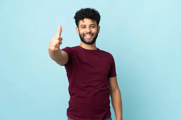 Young Moroccan Man Isolated Blue Background Thumbs Because Something Good — Stockfoto