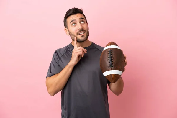 Young Caucasian Man Playing Rugby Isolated Pink Background Thinking Idea — Stock Photo, Image