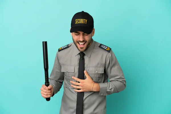 Joven Hombre Seguridad Aislado Sobre Fondo Azul Sonriendo Mucho — Foto de Stock