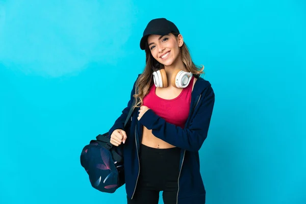 Young Sport Woman Sport Bag Isolated Blue Background Celebrating Victory — Stok fotoğraf