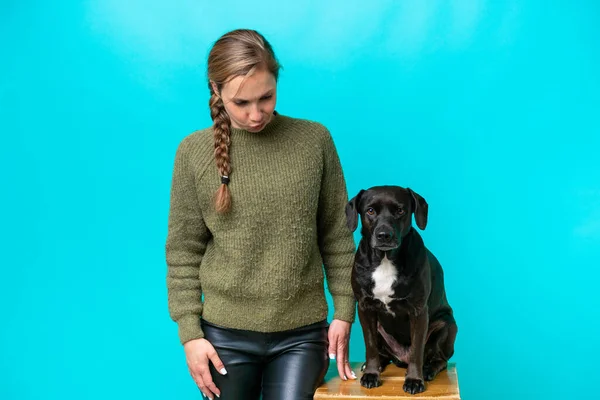 Young Caucasian Woman Her Dog Isolated Blue Background Sad Expression — Zdjęcie stockowe