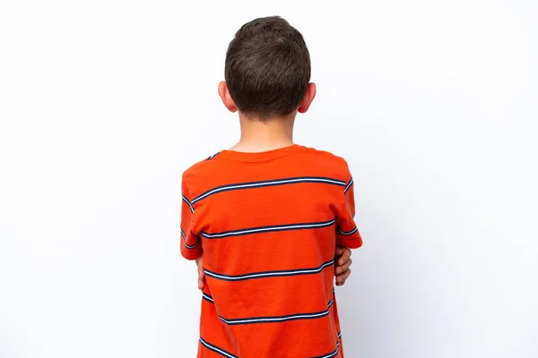 背部の白い背景に隔離された小さな男の子 — ストック写真