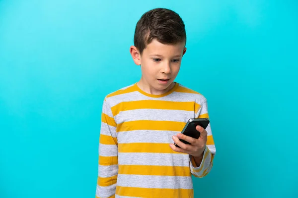 Little Boy Isolated Blue Background Sending Message Email Mobile — Stock Photo, Image