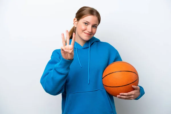 若いですCaucasian女性プレイバスケットボール孤立した上に白の背景幸せとカウント3とともに指 — ストック写真